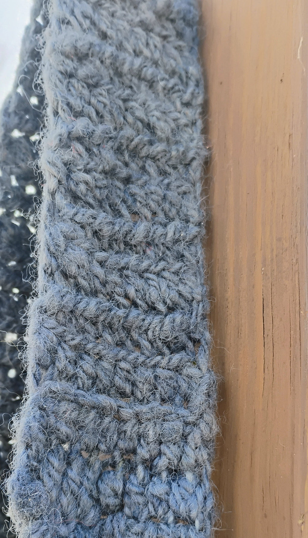 Close-up of wide 3 inch handspun wool crochet strap showing rich texture and hand-dyed denim blue color