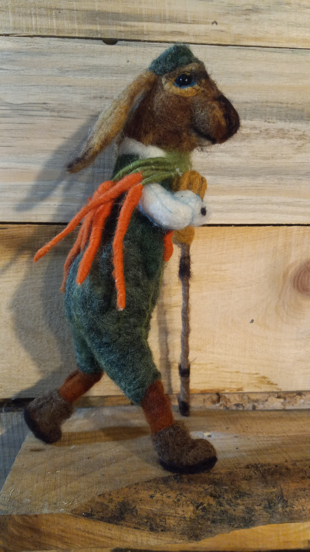 Close-up of double-breasted jacket detail on The Carrot Hunter needle felted rabbit