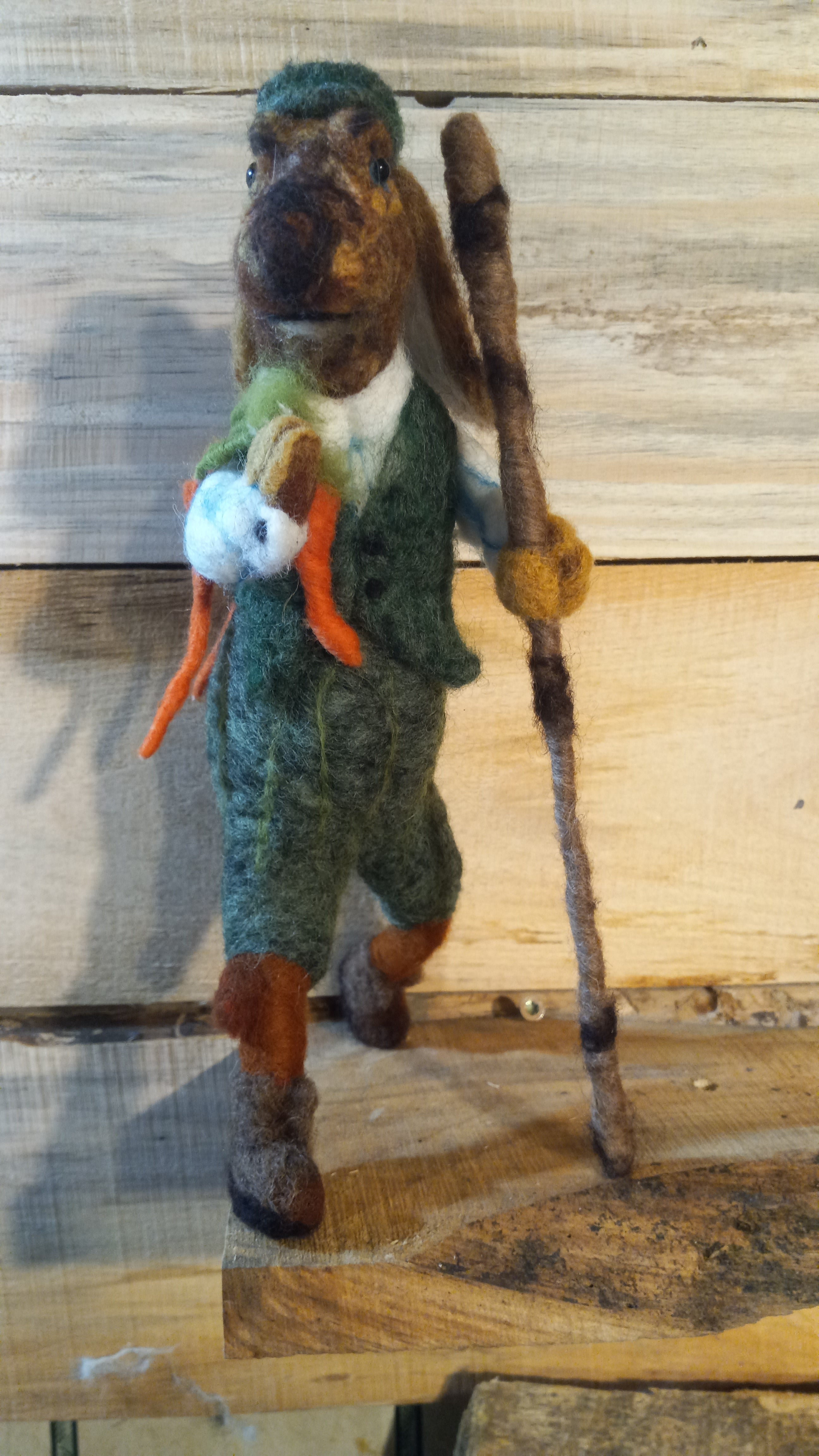 The Carrot Hunter needle felted rabbit sculpture rear three-quarter view showing jacket detail