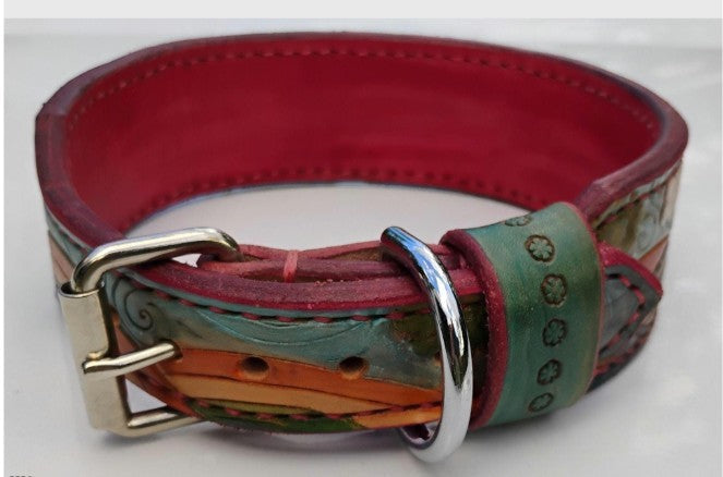 Hand-tooled hippie dog collar buckle detail with red interior lining and silver hardware