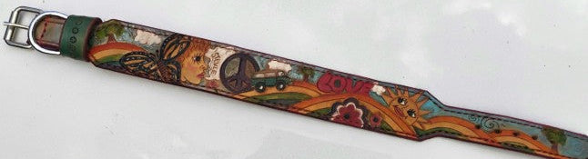 Hand-tooled leather dog collar laid flat showing rainbow, peace sign, VW bus and boho motifs