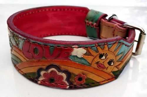 Hand-tooled leather dog collar showing smiling sun, LOVE lettering and flowers with red interior